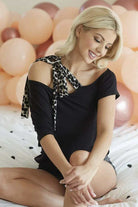Model wearing the Feline Fancy Top by BiBi, showcasing the off-shoulder design with a leopard print strap.
