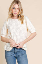 Field of Daisies Top in cream color, featuring puff sleeves and daisy embroidery, perfect for spring fashion.