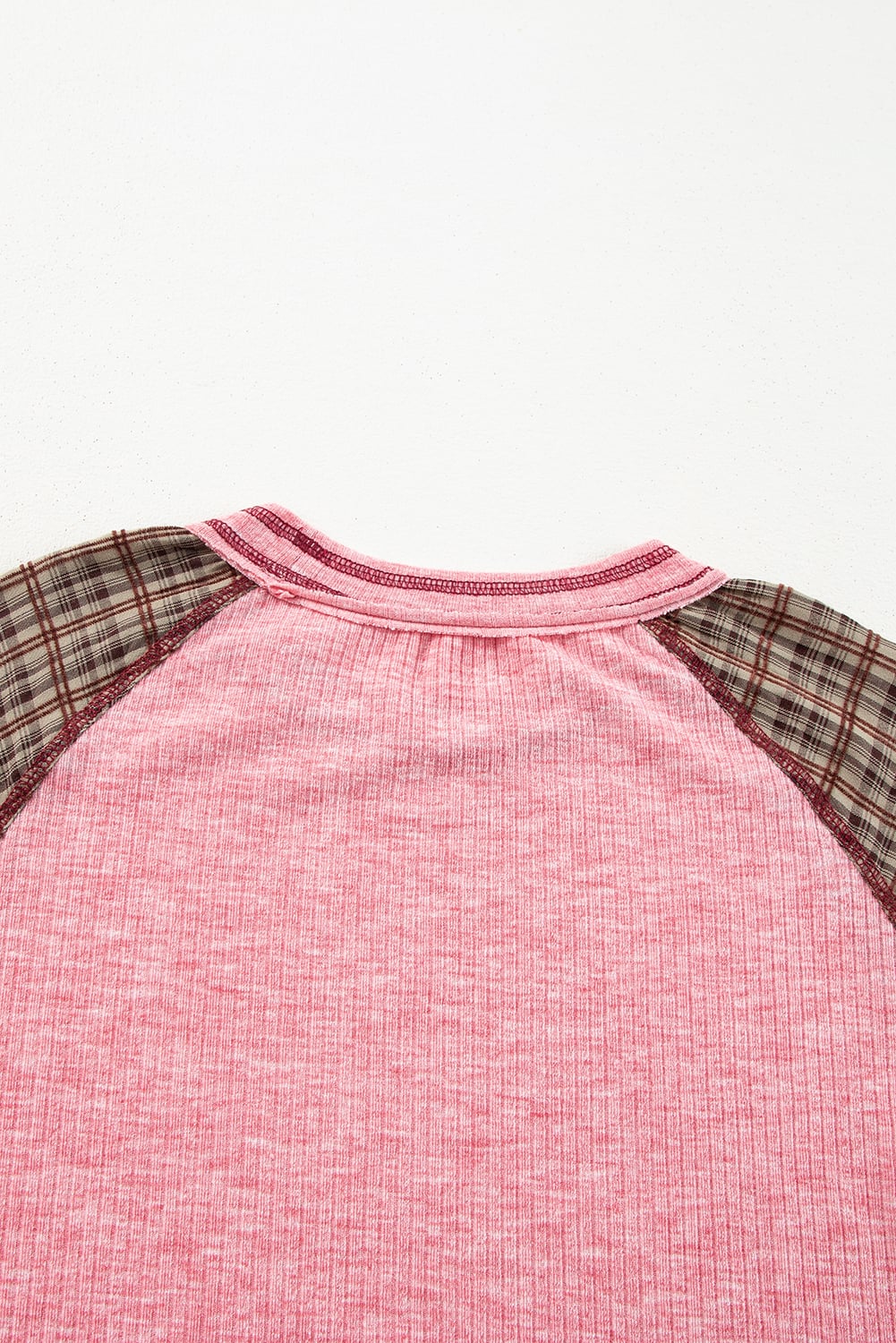 Pink Mixed Blessings Top with plaid raglan sleeves, showcasing ribbed texture and unique patchwork design.