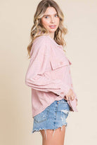 Women's pink embossed shacket with dolman sleeves, button front, and flap pockets, perfect for casual layering.