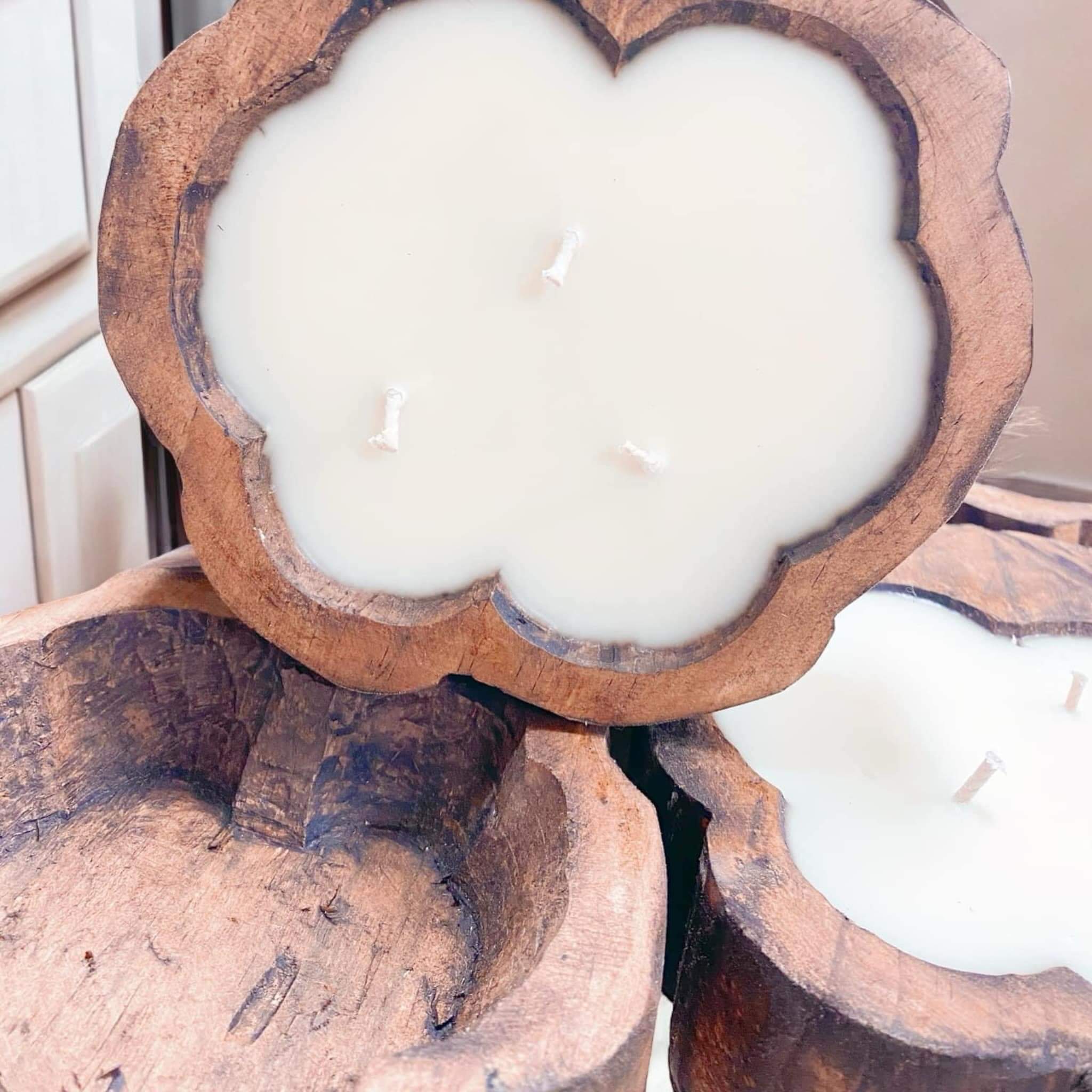 Handcrafted cotton boll candles in rustic dough bowls, made with 100% soy wax and eco-friendly wicks for a farmhouse charm.