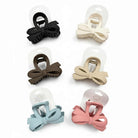 DAILY DARLING BOW HAIR CLIP (6 colors) displayed in six elegant color options on packaging.