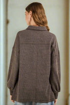 Back view of NT11852X-PLUS oversized collared button-down knit top featuring long sleeves and a hi-lo hem.