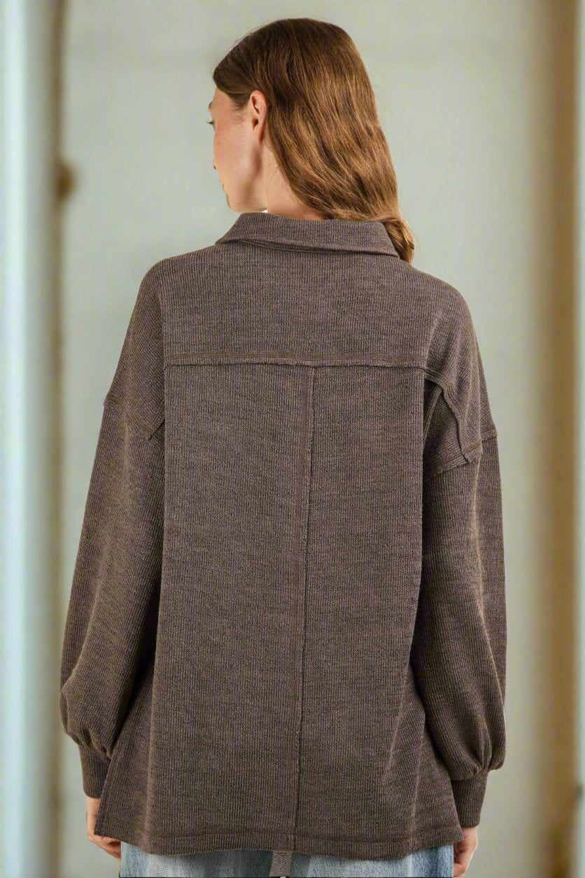 Back view of NT11852X-PLUS oversized collared button-down knit top featuring long sleeves and a hi-lo hem.