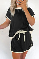 Black Boardwalk Breeze Skort Set featuring a relaxed-fit top and matching drawstring skort for comfort and style.