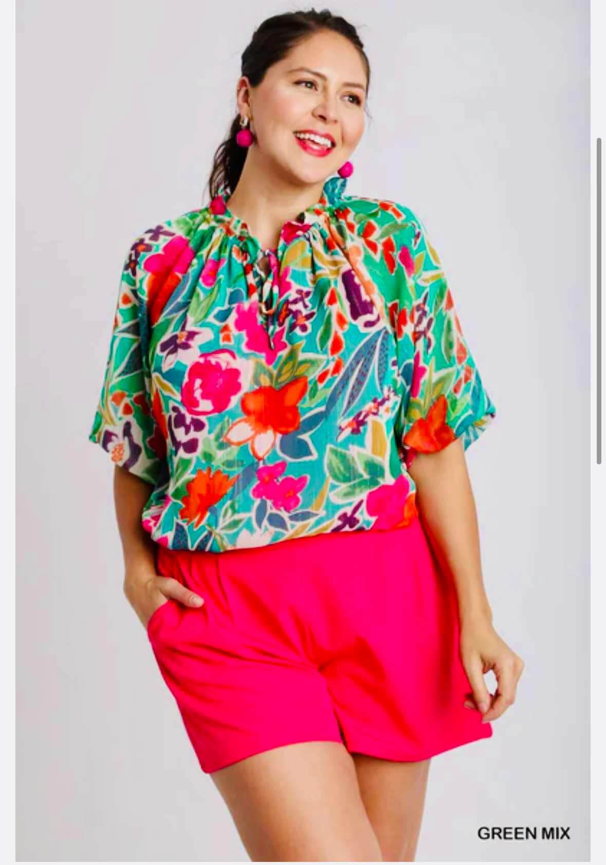 Umgee Plus The Perfect Blend Top featuring vibrant flowers with fuchsia accents, ideal for curvy girls and stylish occasions.