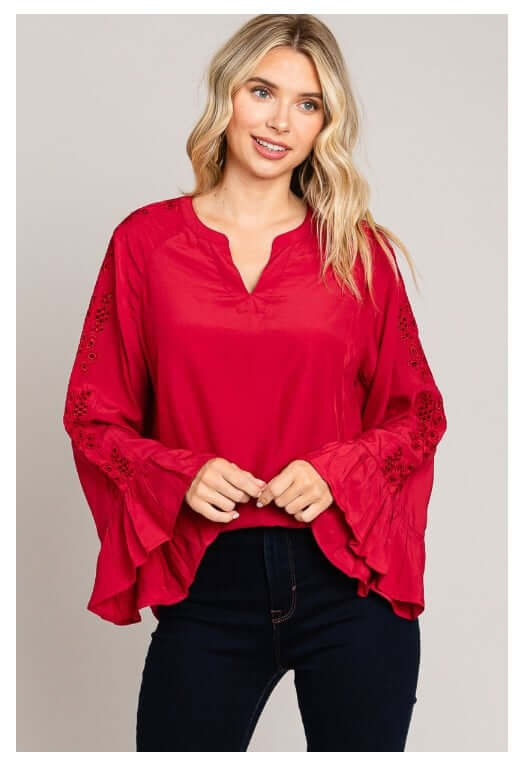 Red VIP ACCESS top from Cotton Blue with bell sleeves and eyelet detailing, perfect for a stylish and sophisticated holiday look.