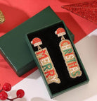 Merry Christmas Santa earrings in vibrant red, green, and gold, perfect holiday accessory in gift box.