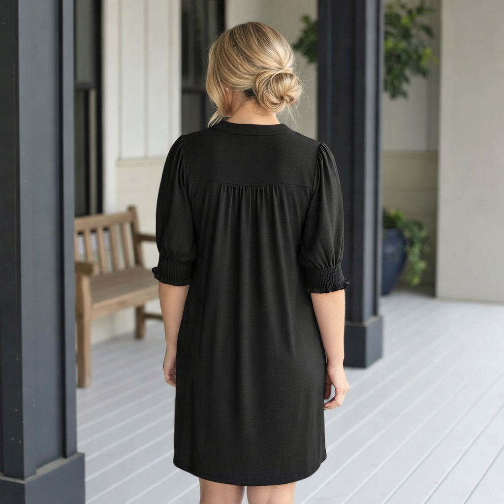 Back view of a woman wearing HELLO BEAUTIFUL DRESS- Dear Scarlett (black) showcasing its chic design and comfortable fit.
