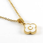 MONOGRAM MOMENTS NECKLACE featuring a gold-plated pendant with a white background and an initial 'C' design.