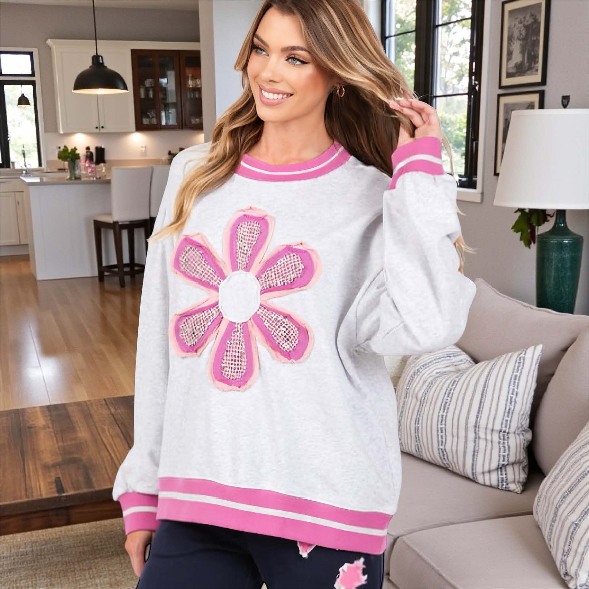 DAYDREAM BELIEVER - Sage + Fig (gray) crew neck pullover with oversized fit and daisy appliqué in cozy setting.