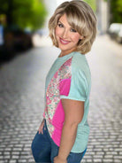 Model wearing the Breath of Fresh Air Top, showcasing floral print and ribbed texture in a stylish pose.