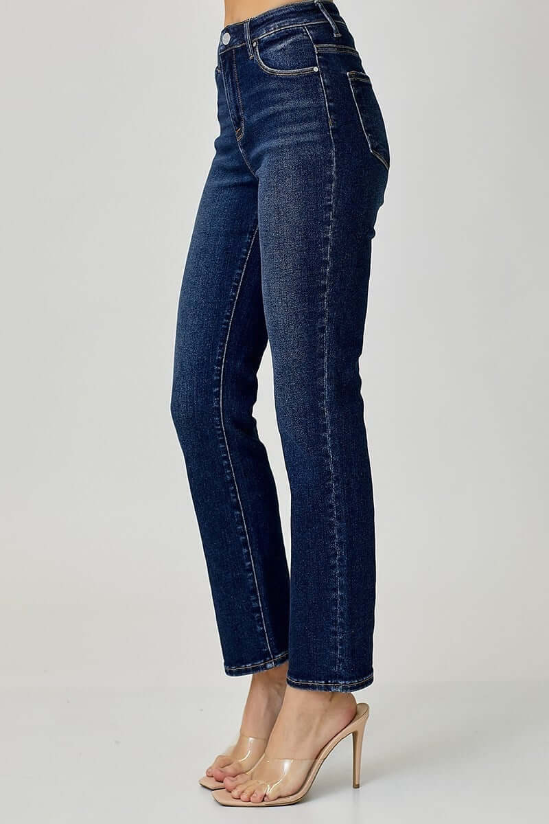 Model showcasing midrise ADELINE jeans by Risen in dark wash with a straight cut and stylish design.