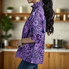 Model showcasing the DreamLand Top in purple and navy with chic collar and ruffled sleeves, perfect for any occasion.