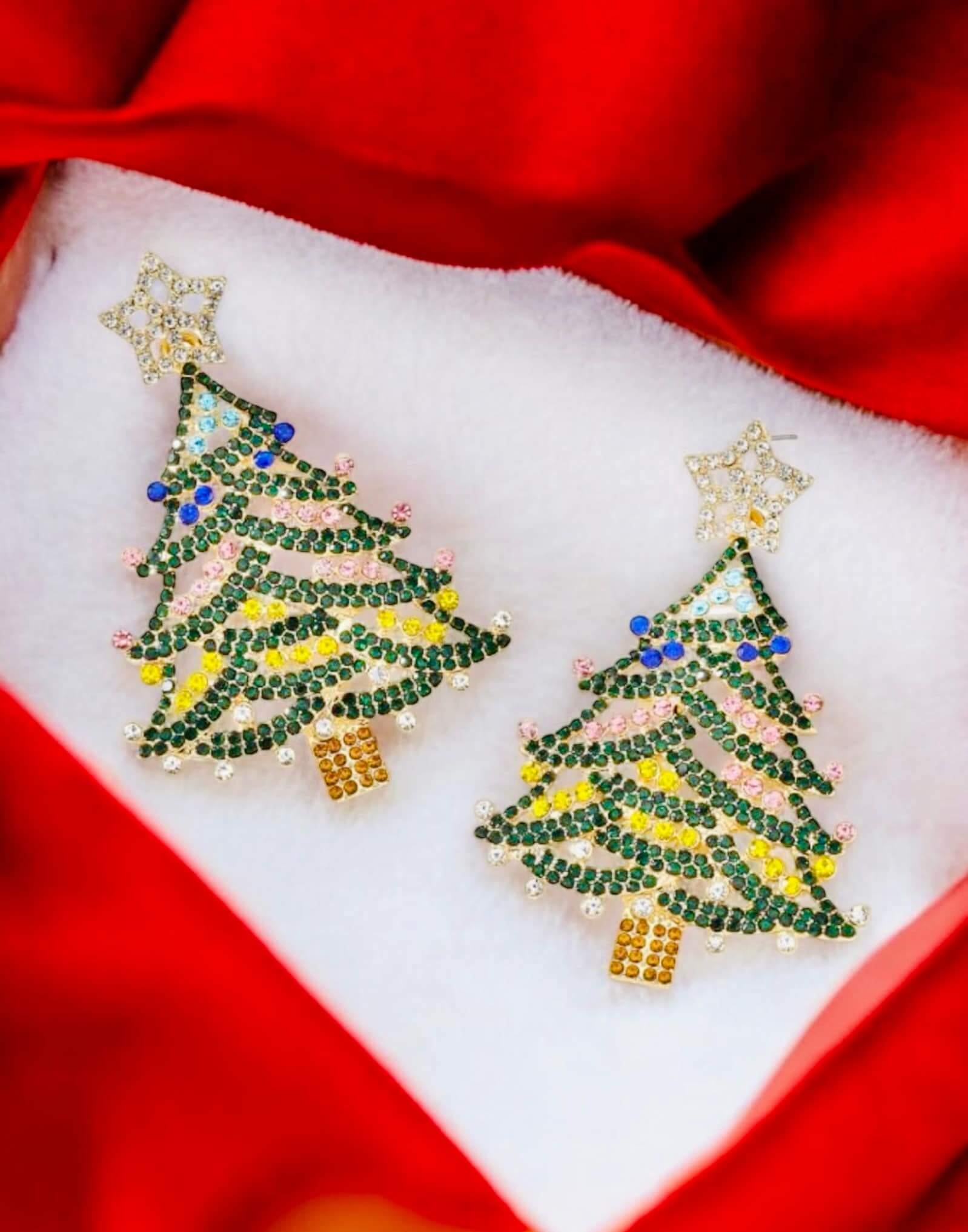 Stunning Evergreen Christmas Tree Earrings with rhinestone star and multicolor gems on a red backdrop. Perfect for festive occasions.