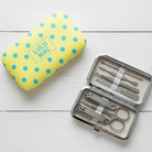 MCPD- Butter/Blue Dot Manicure Set features stylish yellow polka dot case and essential nail care tools.