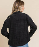 Women's black embossed soft casual shacket with relaxed dolman sleeves, perfect for layering in transitional weather.