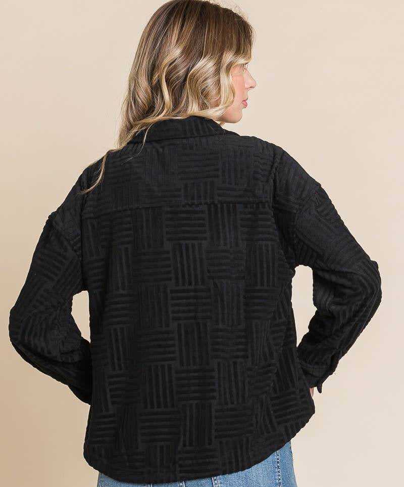 Women's black embossed soft casual shacket with relaxed dolman sleeves, perfect for layering in transitional weather.
