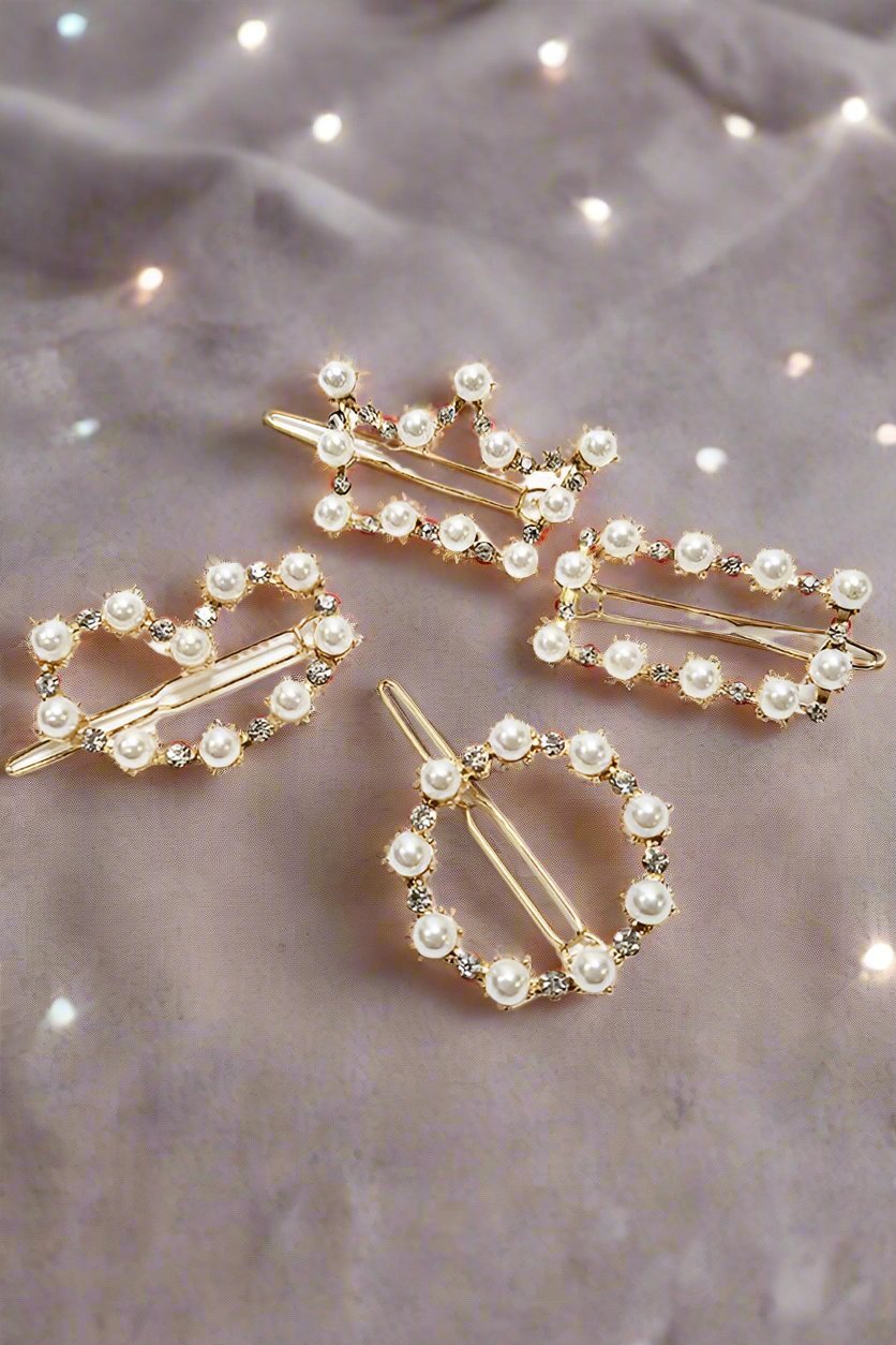 Set of two pearl and rhinestone barrettes in round and crown designs, elegant gold tone holiday accessories.