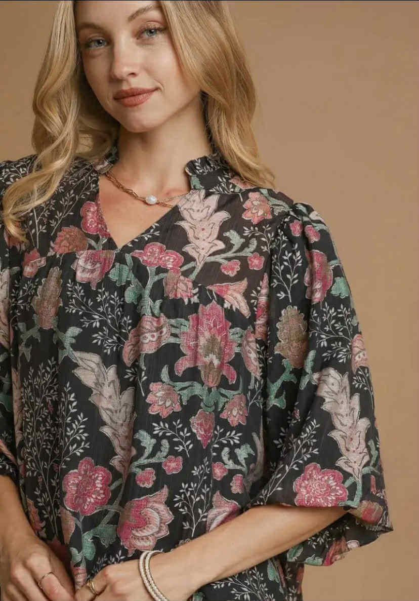 Model wearing the FOREVERMORE TOP - Umgee, featuring a floral print, v-neckline, and puff sleeves.