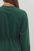 Back view of EVERGREEN BREEZE dress in dark green, featuring a drawstring waist and crewneck design.