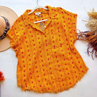 Hello Happiness Top by Umgee in sunny yellow with heart motifs and frayed details, perfect for a cheerful outfit.