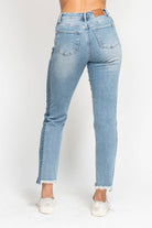 Back view of JUDY BLUE - HADLEY JEANS showcasing high-rise fit and hi-lo fray hem.