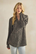 ET7975-14 LONG SLEEVE V NECK ANIMAL URBAN RIB TOP in leopard print fabric with model wearing it.