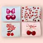 Cherry Pie cosmetic bags featuring four fun styles: Disco Cherries, Cherry Coquettes, Cherry Bomb, and Cherries Tied with a Bow.