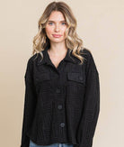 Women's lightweight black shacket with embossed texture and button-down front, perfect for casual layering.