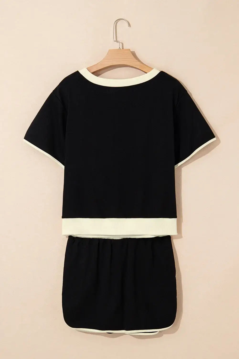 Black Boardwalk Breeze Skort Set featuring a relaxed-fit top and drawstring skort, perfect for sporty chic style.