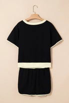 Black Boardwalk Breeze Skort Set featuring a relaxed-fit top and drawstring skort, perfect for sporty chic style.