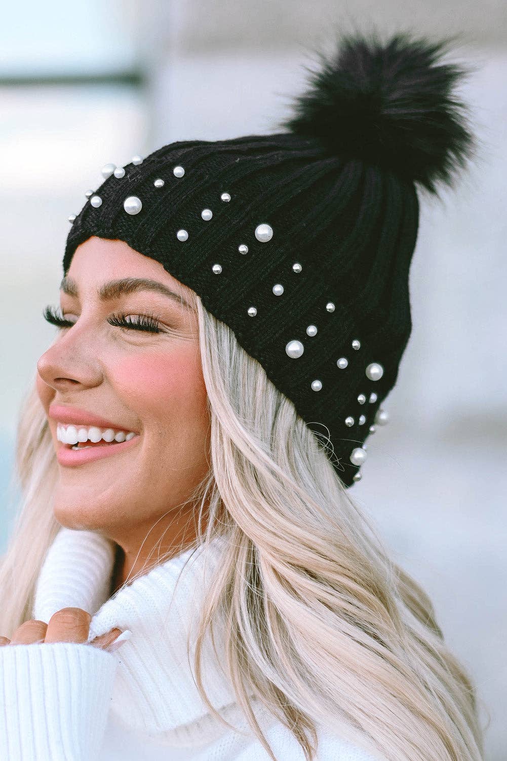 PEARL ESSENCE BEANIE by Lovesoft $10.00 Stunning pearl look beanie for a touch of elegance to any outfit. The playful pom pom adds a pop of fun and trendiness. The cuff design ensures a cozy and snug fit while the knit construction provides warmth and com