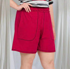 ZENANA contrast stitch lounge shorts in ruby red featuring pockets and elastic waist for ultimate comfort.