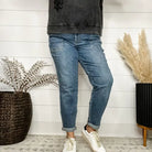 Judy Blue Jane Plus Size Joggers in medium wash, featuring cuffed hems and paired with a stylish top and sneakers.