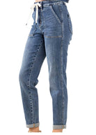 Judy Blue Jane Plus Size Joggers in medium to dark wash with an elastic drawstring waist and cuffed hems.