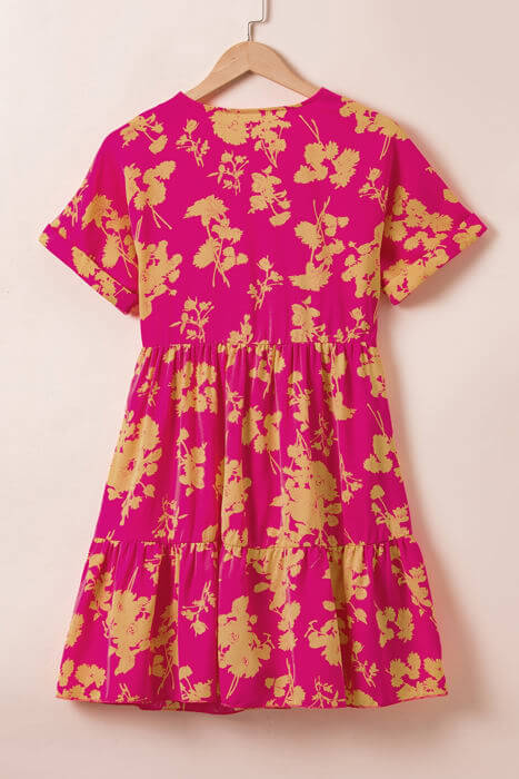 Vibrant pink floral summer dress with batwing sleeves and empire waist design, perfect for all body types.