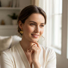 Close-up of a woman wearing FOREVER YOURS EARRINGS, heart-shaped, 18K gold-plated, perfect for any occasion.
