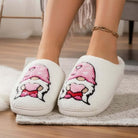 HUGS & HEARTS SLIPPERS with adorable embroidered character in pink hat and hot pink pants, cozy fluffy white sherpa design.