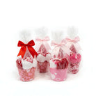 Too Cute to Eat Valentine Sock Cupcakes in gift-wrapped cupcake cups with bows and cellophane.