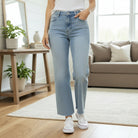 ZELDA WIDE LEG JEANS by Vervet worn by a model, showcasing a high-rise waist and cropped silhouette in a cozy interior.