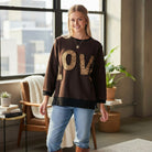 LOVE UNTAMED TOP - Easel, featuring leopard patch letters and soft terry fabric perfect for casual outfits.