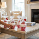 Too Cute to Eat Valentine Sock Cupcakes in clear packaging on a coffee table, ready for gifting and celebrating Valentine's Day.