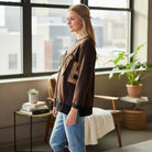 LOVE UNTAMED TOP - Easel showcased by a model, featuring leopard patch letters and a soft, oversized design.