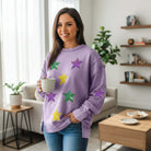 MARDI GRAS STAR PULLOVER featuring sequined star patches, perfect for festive occasions and casual wear.