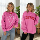 DOUBLE THE LOVE REVERSIBLE PULLOVER in bright pink with heart graphic and LOVER script design.