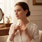 Model wearing LOVE STORY Earrings and Necklace Set (gold), showcasing heart-shaped jewelry in a stylish outfit.