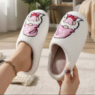 HUGS & HEARTS SLIPPERS featuring fluffy white sherpa, adorable embroidered character, perfect for cozy home wear.
