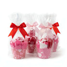 Too Cute to Eat Valentine Sock Cupcakes in colorful cupcake cups, wrapped in cellophane with red and pink bows.