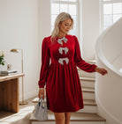 SPARKLE SEASON VELVET DRESS (Holiday Red) featuring rhinestone bows and luxurious red velvet.
